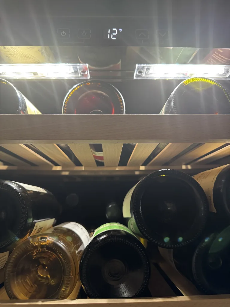 LeCavist Wine Fridge 294 bottle capacity - wooden shelves and light